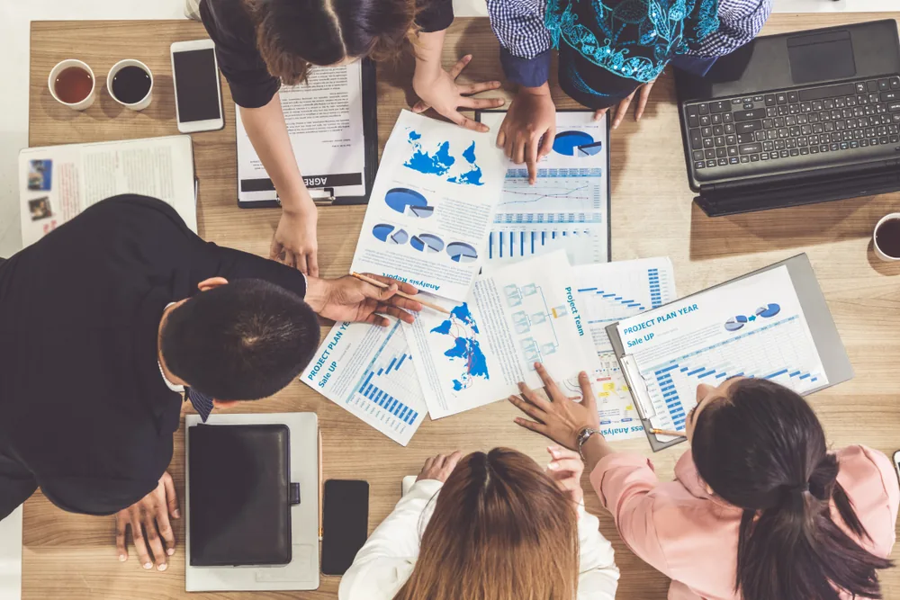 Marketing manager planning strategies at a desk